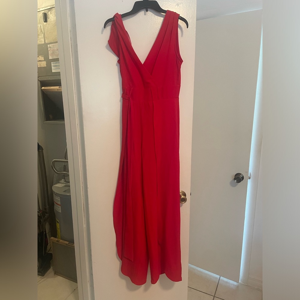 Red jumpsuit with slit on both sides. Size 4. Perfect for wedding guest attire.